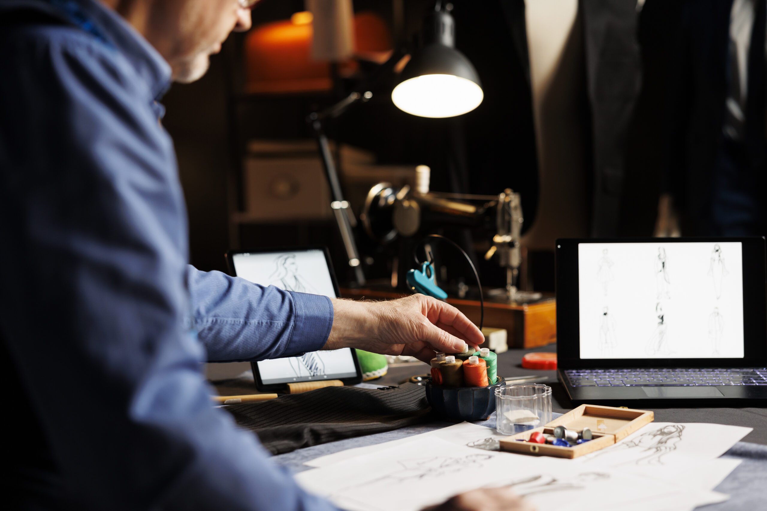 Couturier working on fashion collection mission